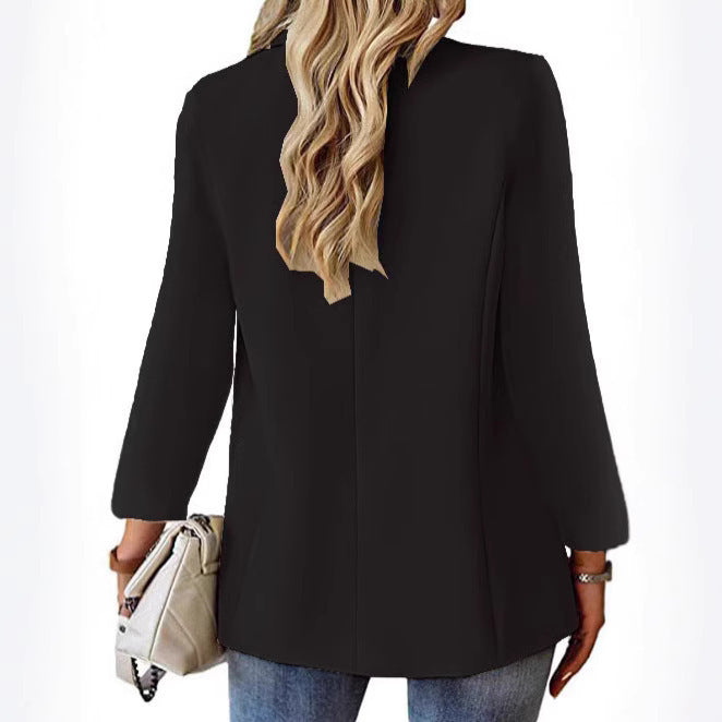 Ladies longline blazer in oversized style with a striking lapel, metal button, and patch pockets Mune Fashion