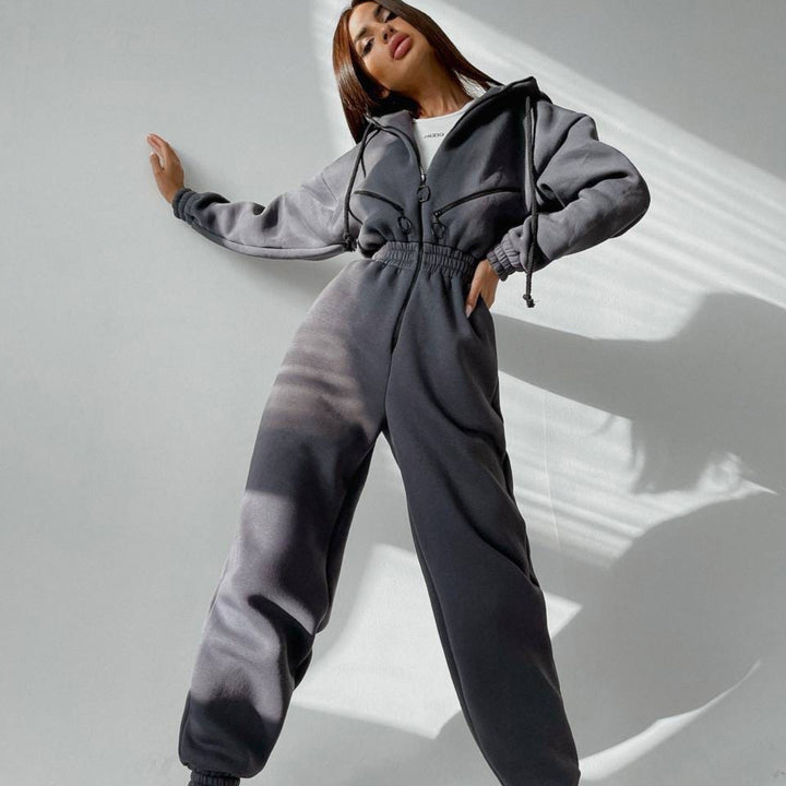 Women's tailored hooded jumpsuit with elastic waistband and striking contrast zippers Mune Fashion
