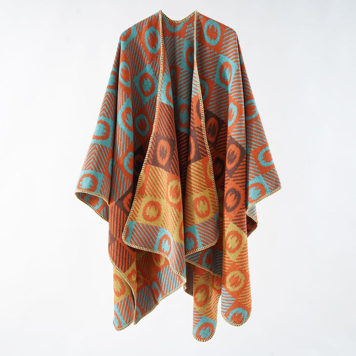 Women's jacquard wrap poncho made of fine knit with graphic circle jacquard and open kimono silhouette.