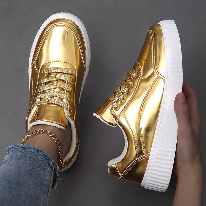 Ladies' low-cut sneakers with reflective patent upper, padded shaft, and raised outsole with groove profile Mune Fashion