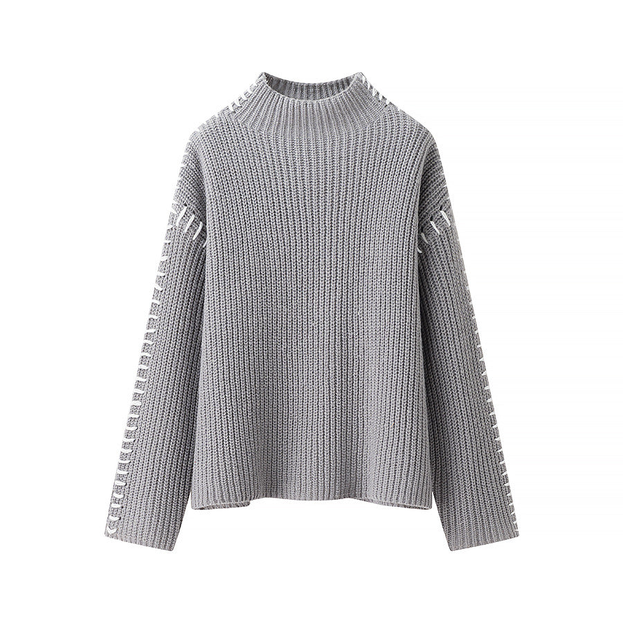 Women's chunky knit oversized sweater with high roll neck edge and decorative stitch sleeves Mune Fashion