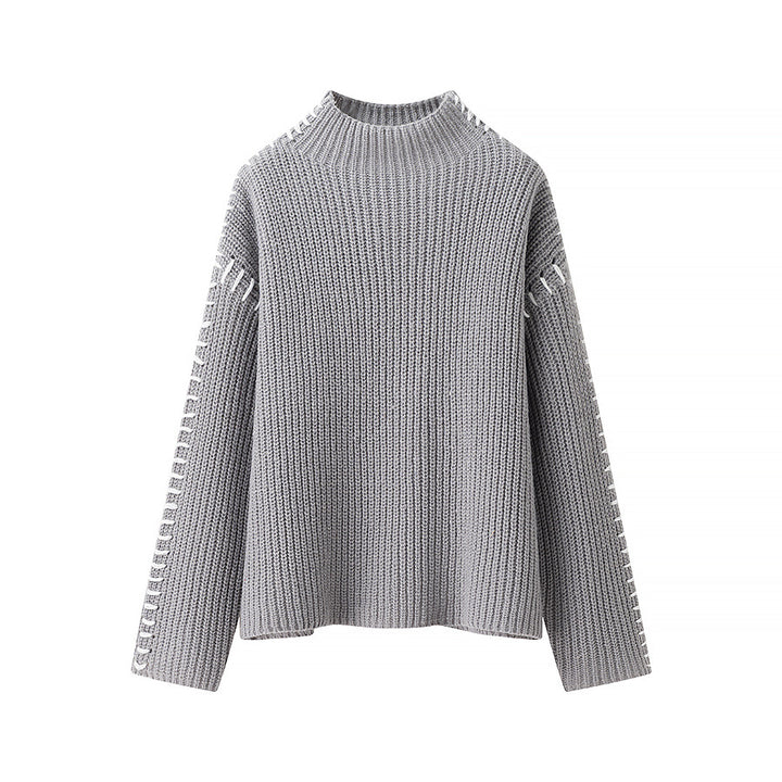 Women's chunky knit oversized sweater with high roll neck edge and decorative stitch sleeves Mune Fashion