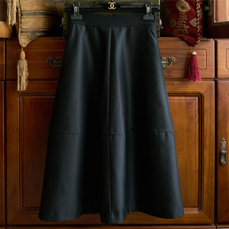 Women's midi skirt made of vegan leather with a high waist and tiered A-line Mune Fashion