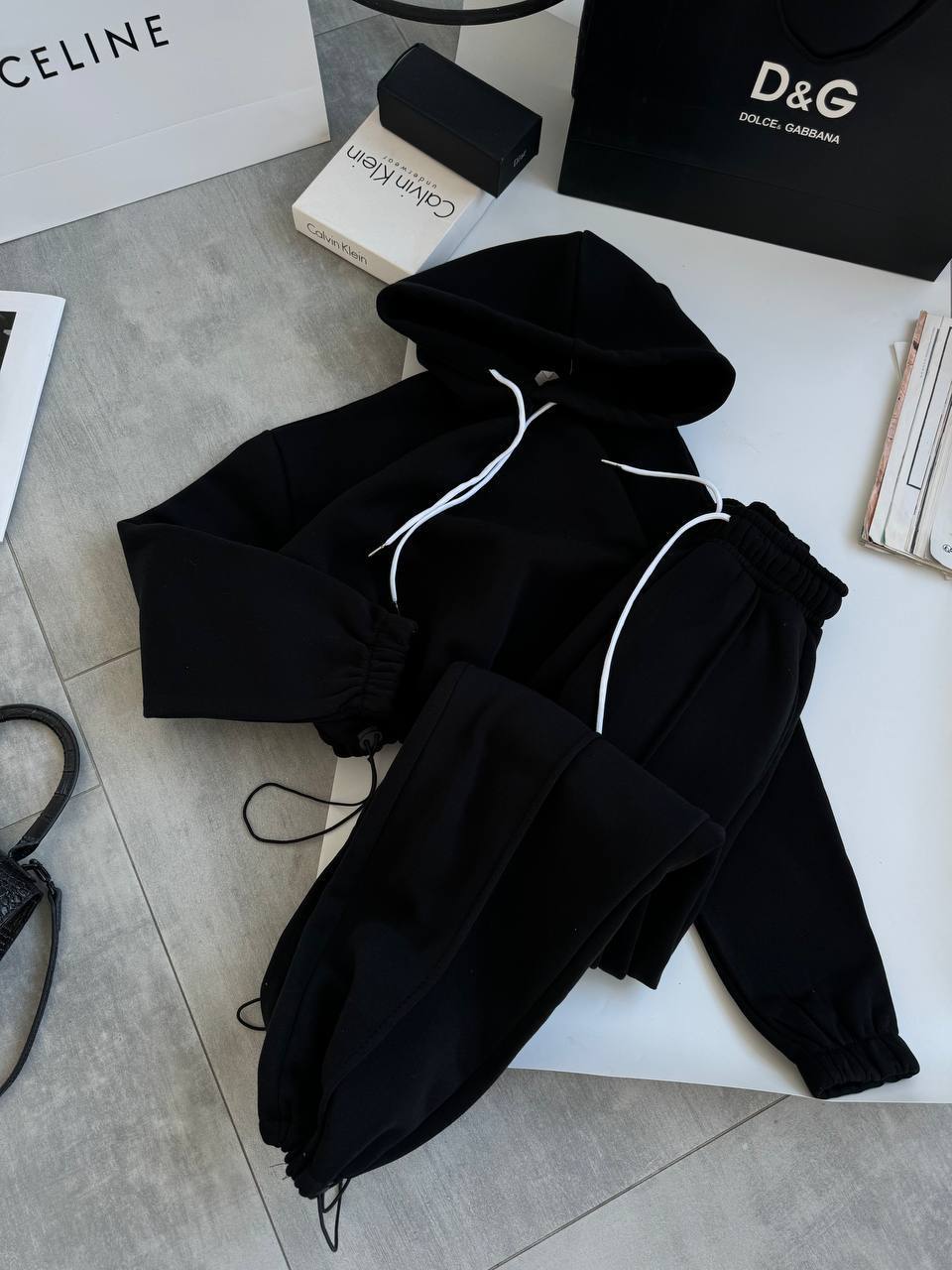 Women's oversized hoodie and jogger set with soft inner lining, adjustable drawstring, and raised waistband.