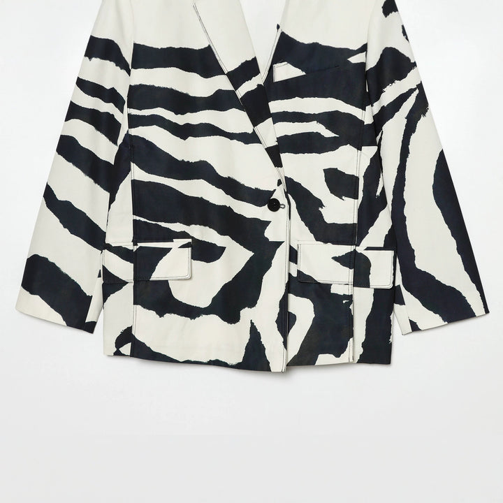 Women's oversized zebra print blazer with shawl collar, single button closure, and patch pockets Mune Fashion