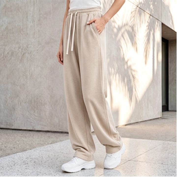 Women's wide lounge palazzo pants with high comfort waistband, drawstring, side pockets, and decorative side seam Mune Fashion
