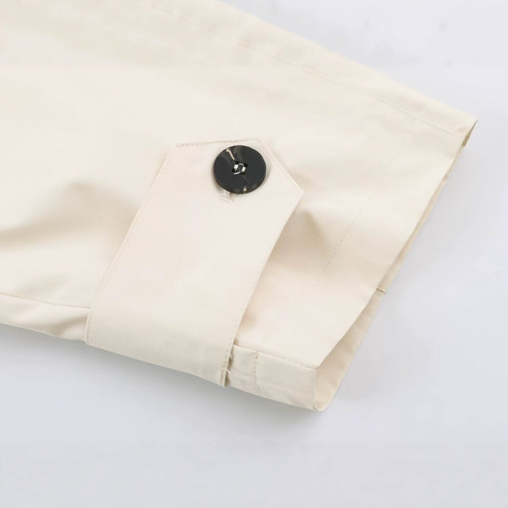 Women Short Boxy Trench Coat with Asymmetrical Button Placket and Arm Straps Mune Fashion