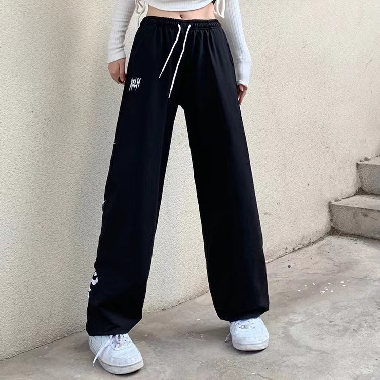Women's high-waisted wide-leg jogging pants with a significant side print Mune Fashion