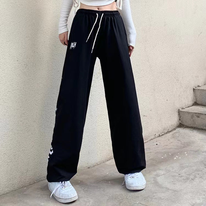 Women's high-waisted wide-leg jogging pants with a significant side print Mune Fashion