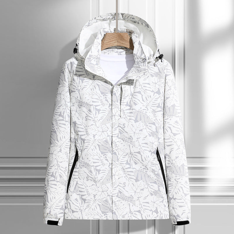 Women's lightweight packable rain and wind jacket with hood, leaf pattern and concealed zippers Mune Fashion