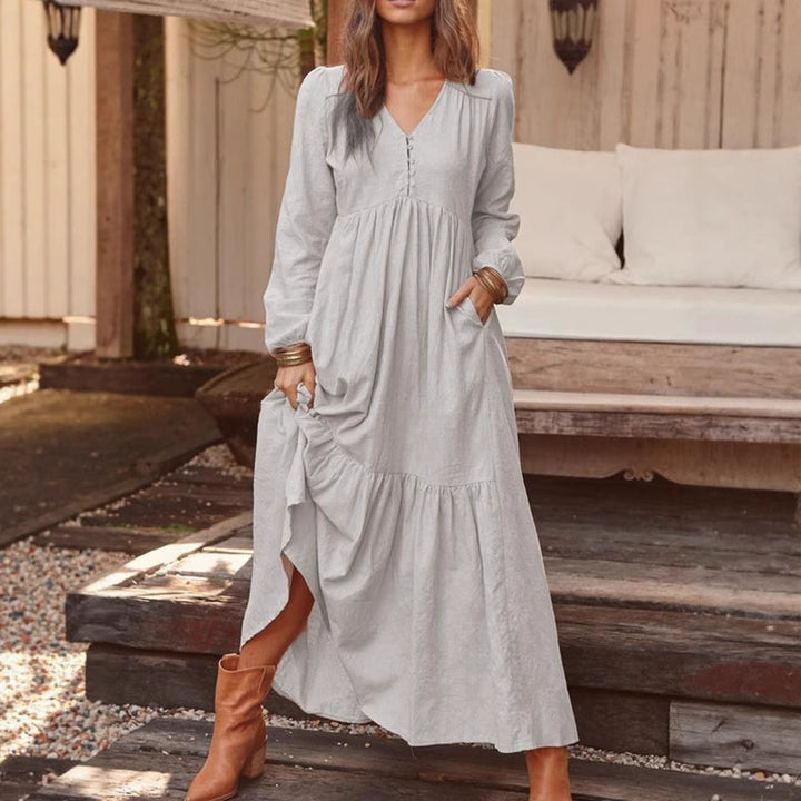 Women's airy maxi dress with V-neck, long sleeves, and side pockets Mune Fashion