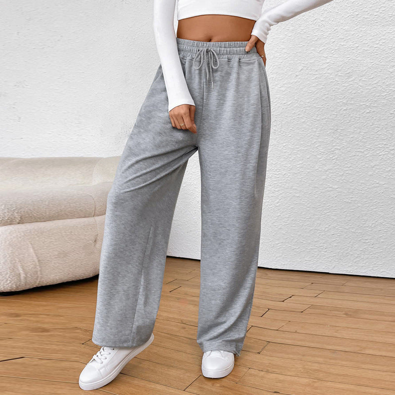 Women's wide sweatpants with elastic waistband, drawstring and adjustable hem.
