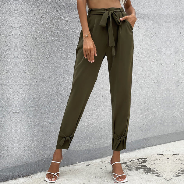 Women’s paperbag pants with tie belt, loose waist and knot detail on the leg Mune Fashion
