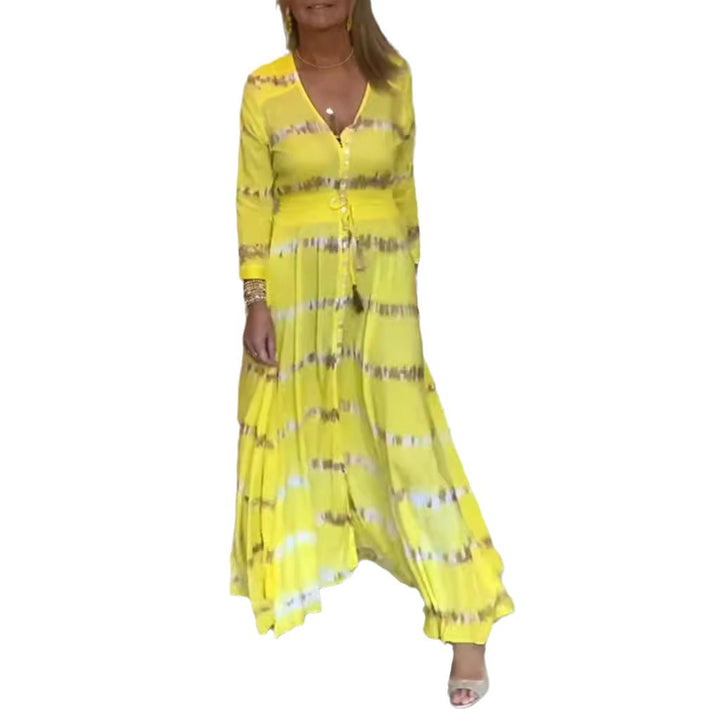 Women's flowing maxi dress with V-neck, full button placket, fitted tassel belt, and pleated skirt Mune Fashion