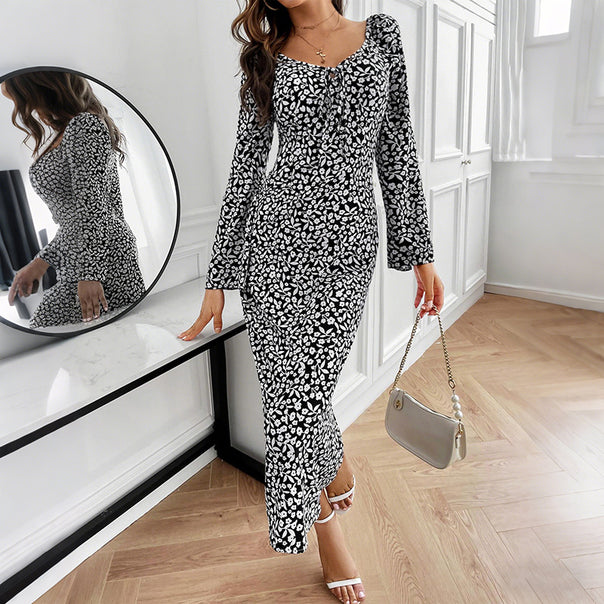 Women’s floral midi dress with fitted wrap look and flared trumpet sleeves Mune Fashion