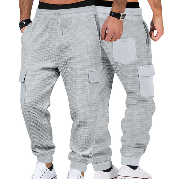Men's cargo jogging pants with waffle texture, elastic waistband, and flap pockets Mune Fashion