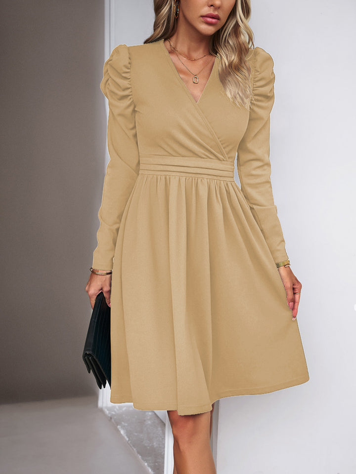 Women's wrap dress with V-neck, gathered puff sleeves, and fitted pleated skirt Drune