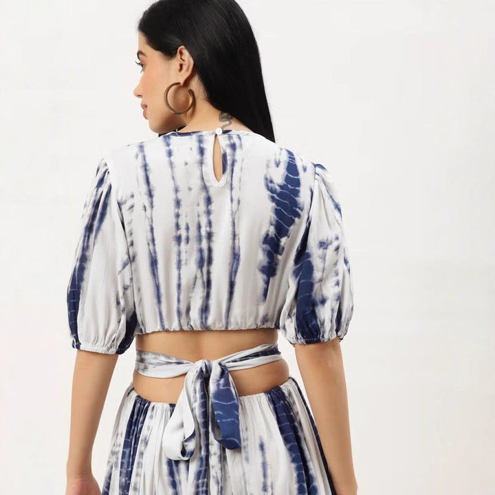 Women’s midi dress with tie-dye print, fitted cut, side cut-out, and ruffled hem.