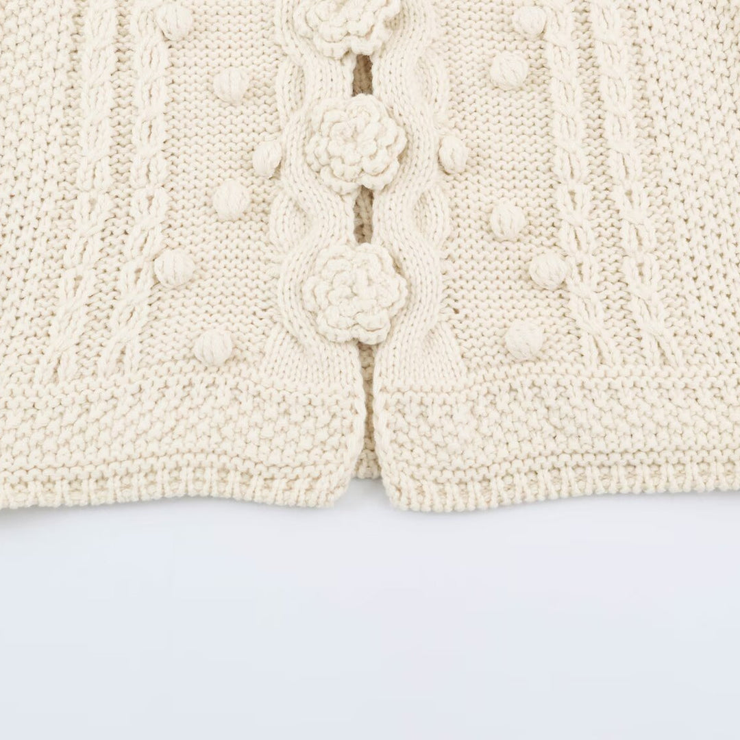 Women's knitted vest with cable pattern, flower appliqués and bobble texture Mune Fashion