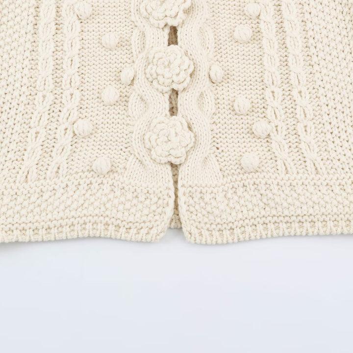 Women's knitted vest with cable pattern, flower appliqués and bobble texture Mune Fashion