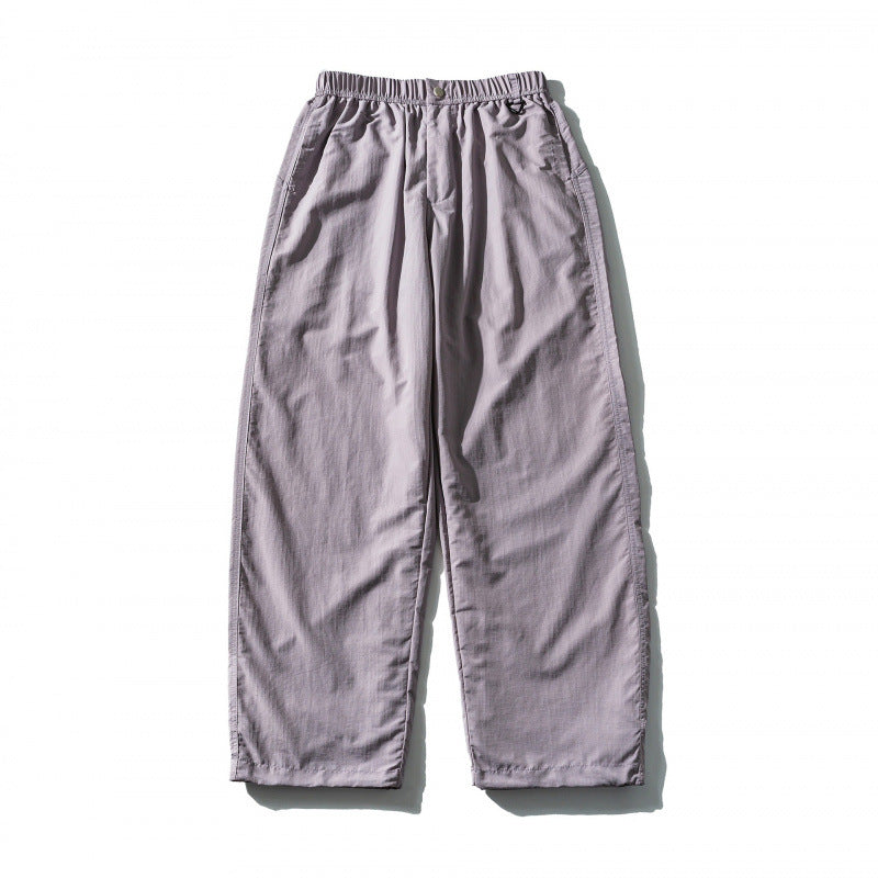 Unisex Loose Crinkle Pants with elastic drawstring waistband, drop-crotch, and side pockets Mune Fashion