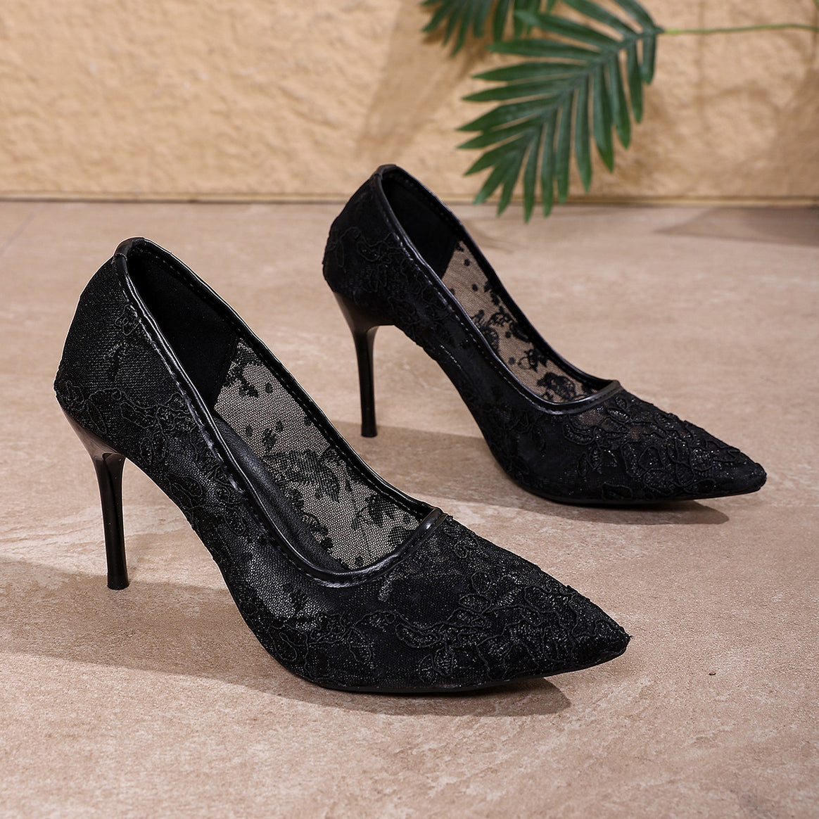 Women’s pointed bridal pumps made of floral lace with transparent mesh and metal stiletto heel