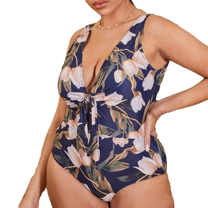 Ladies one-piece swimsuit with floral design and trendy wrap detail Mune Fashion