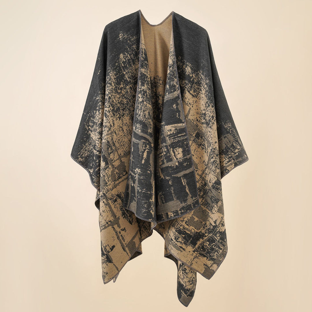 Women's wool blend cape with graphic jacquard, open kimono fall, and soft draping.