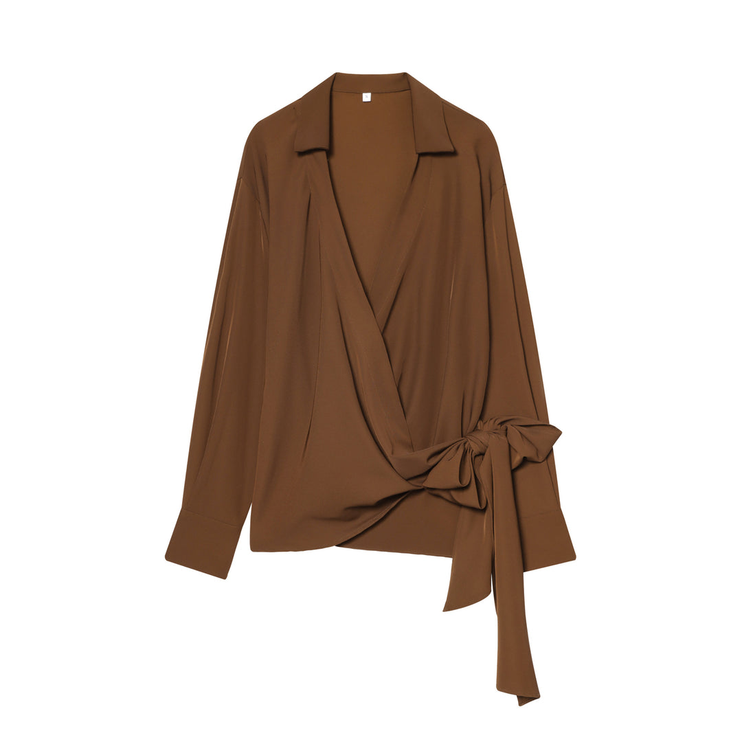Women's flowing wrap blouse with wide lapel collar, dropped shoulder, and decorative side tie Mune Fashion
