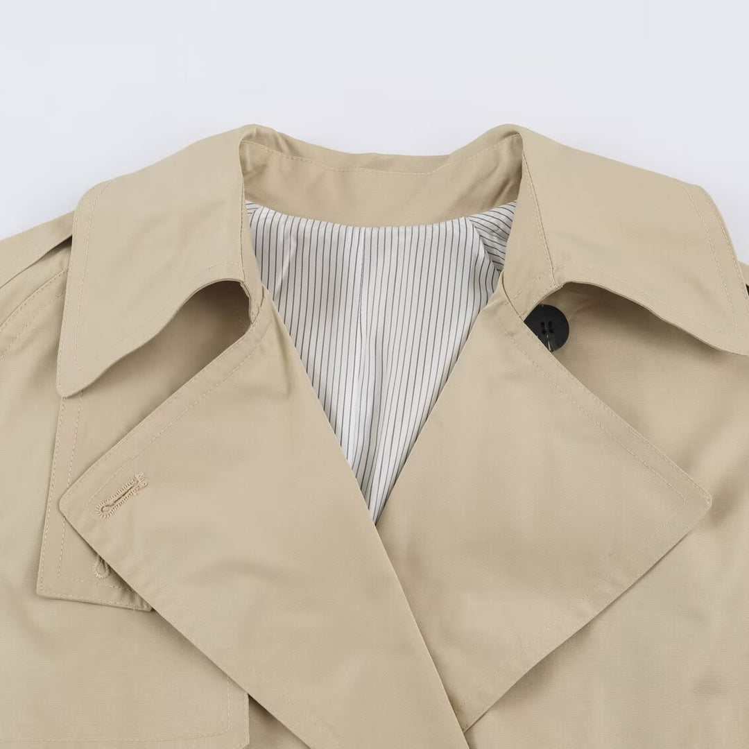 Women's short lightweight trench coat with tie belt, dropped shoulders and double button placket Mune Fashion