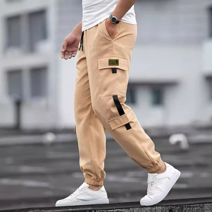 Men's fashionable cargo jogger pants with elastic waistband, drawstring, and multiple security and flap pockets Mune Fashion