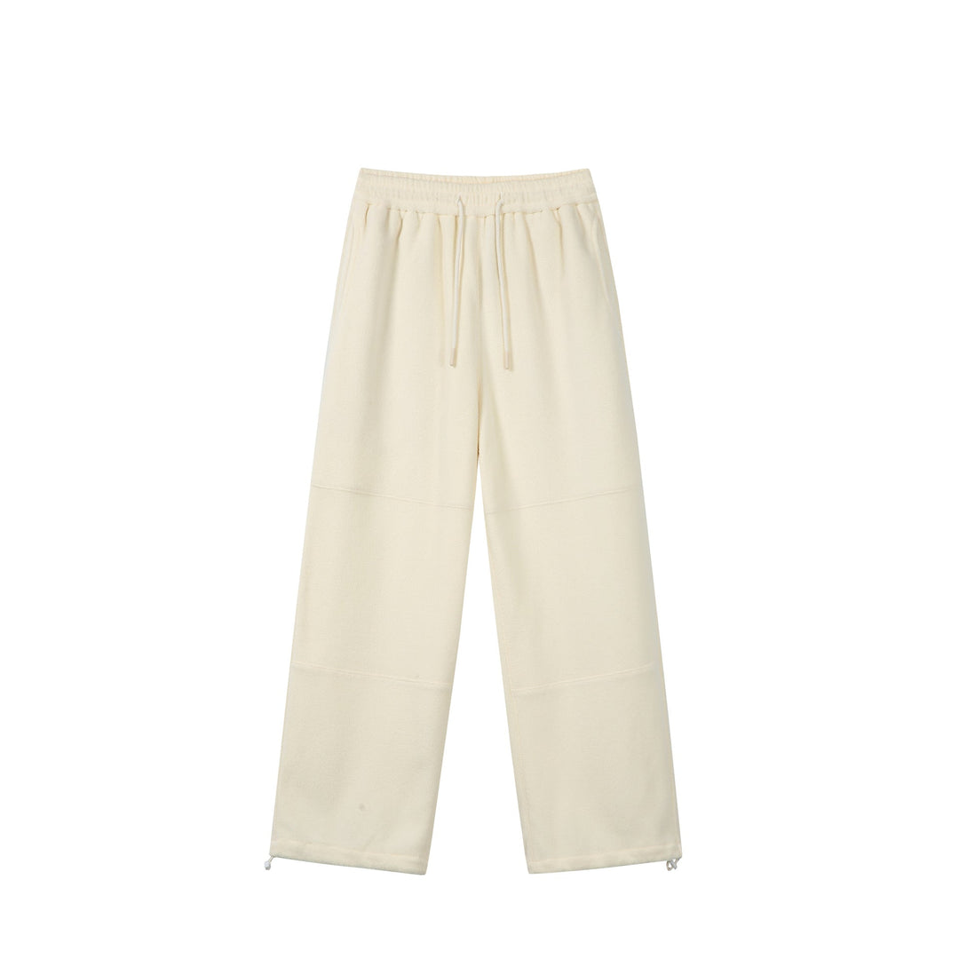 Women's wide fleece jogging pants with drawstring waistband, side pockets, and adjustable hem.