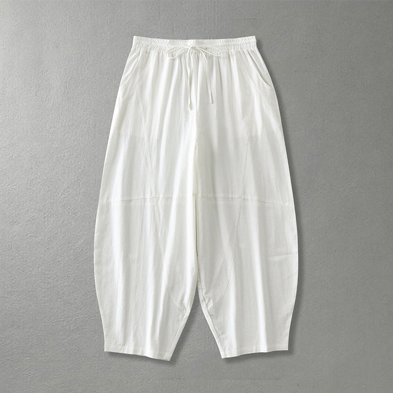 Women's wide harem pants made of lightweight satin with drawstring and side pockets Mune Fashion
