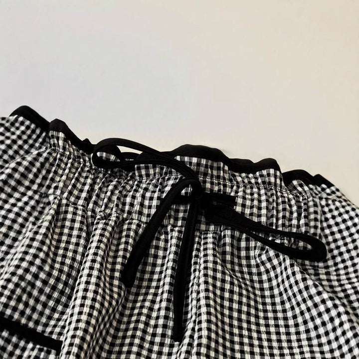 Women's wide Vichy pants with high smocked waist, drawstring, and patch pockets