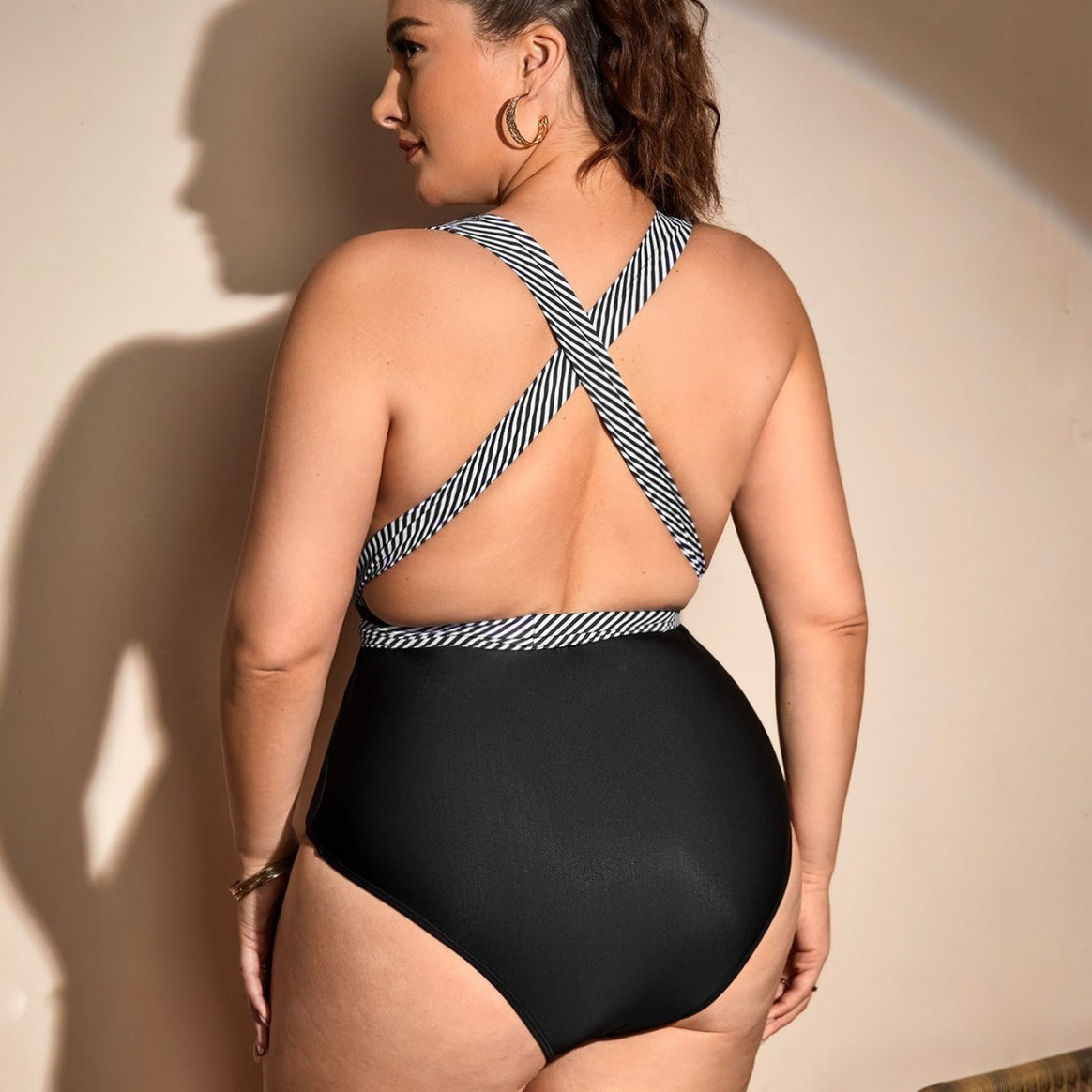 Ladies one-piece swimsuit with wrap detail and trendy stripe pattern Mune Fashion