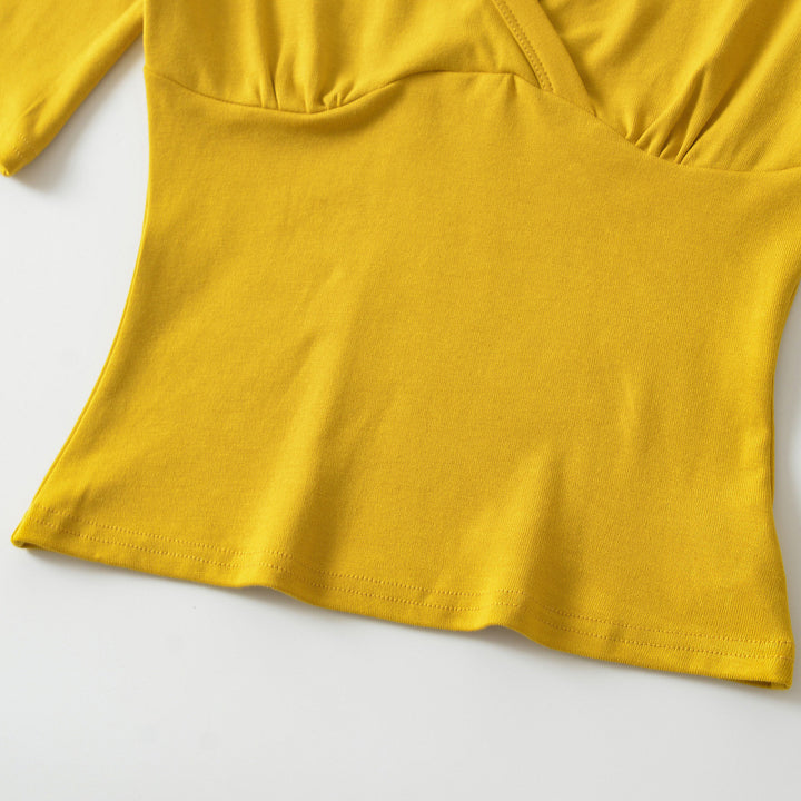 Women's body-hugging wrap shirt with deep V-neck, three-quarter sleeves, and waist accentuation Mune Fashion