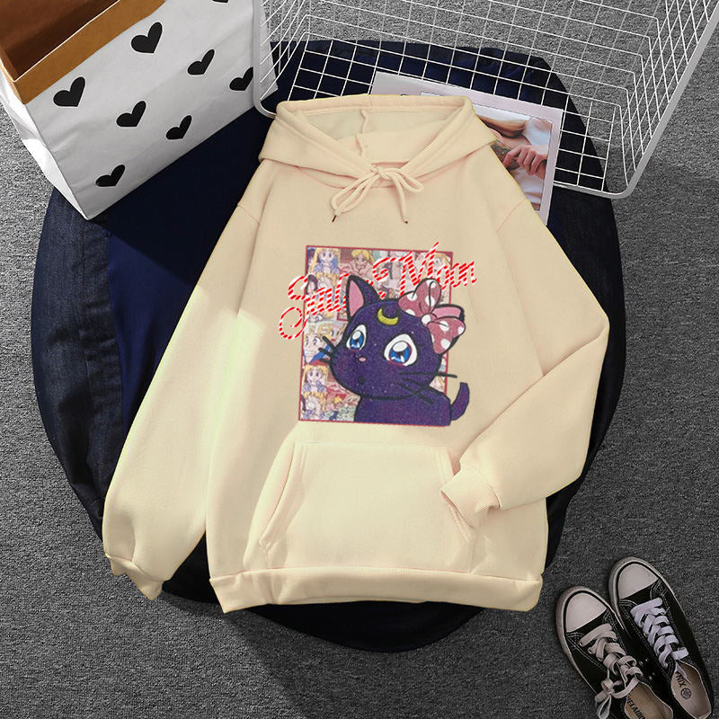 Women's oversized hoodie with shimmering anime cat motif, kangaroo pocket, and soft fleece lining Mune Fashion