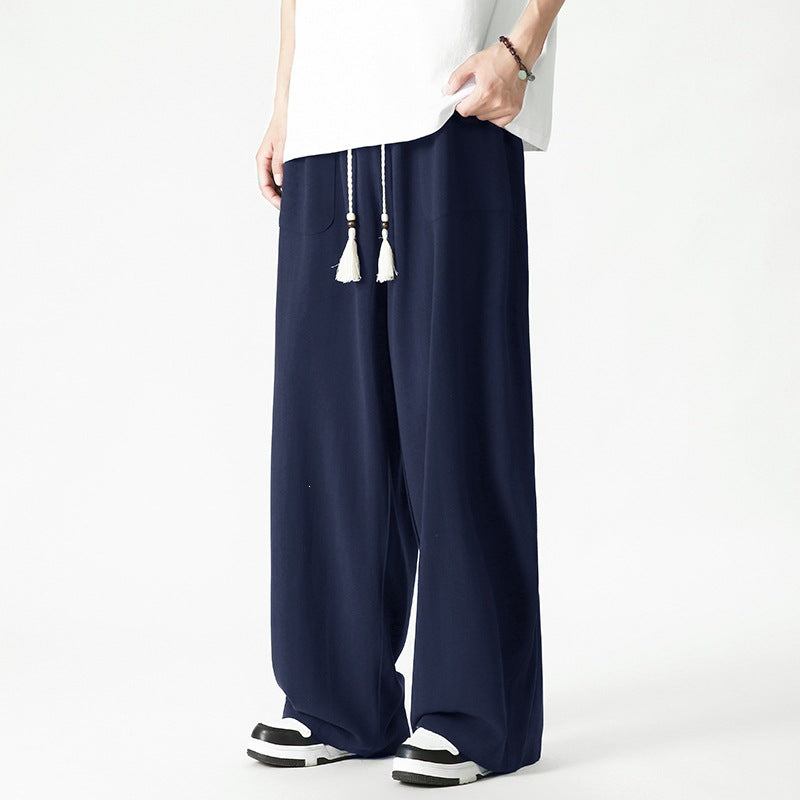 Men's loose-fitting lounge pants with tassel cord, elastic waistband, and patch pockets Mune Fashion