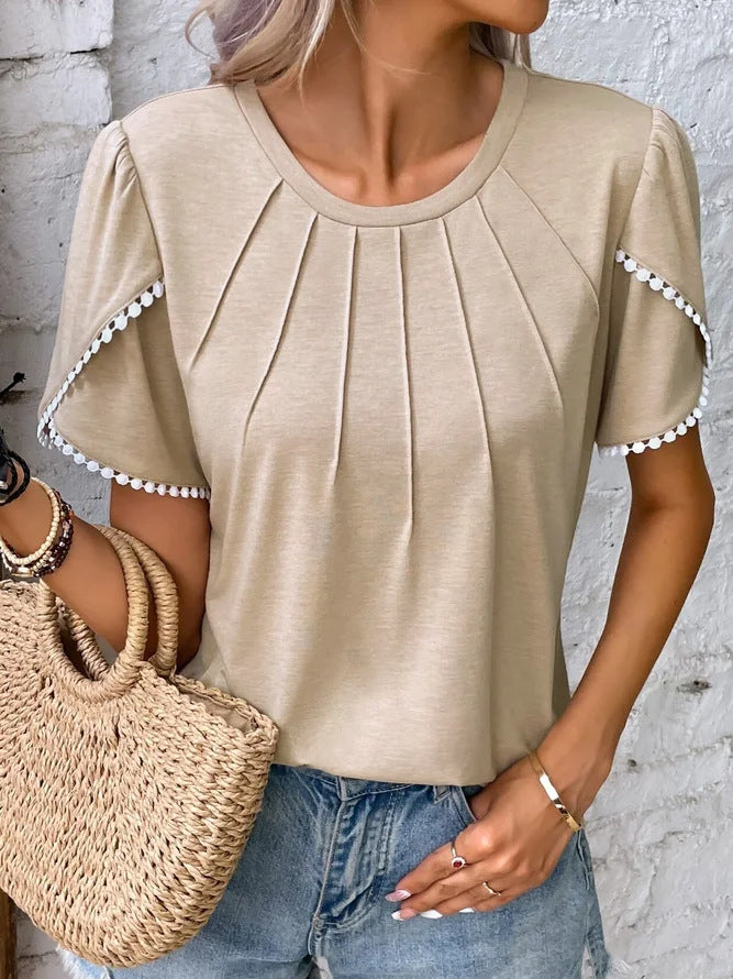 Women's round neck shirt with decorative pleated front, flutter sleeves and pompom trim Mune Fashion