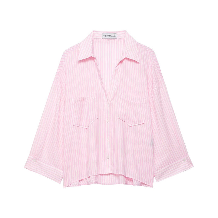 Women's oversized shirt blouse with fine striped pattern, chest pockets, and high-low hem Mune Fashion