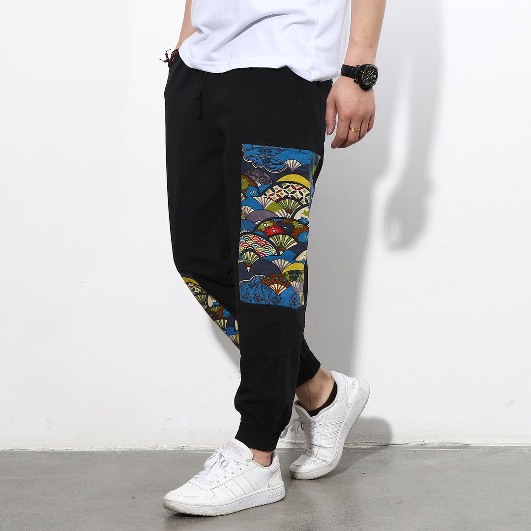 Men's jogging pants with side panel prints, drawstring and ribbed cuffs Mune Fashion