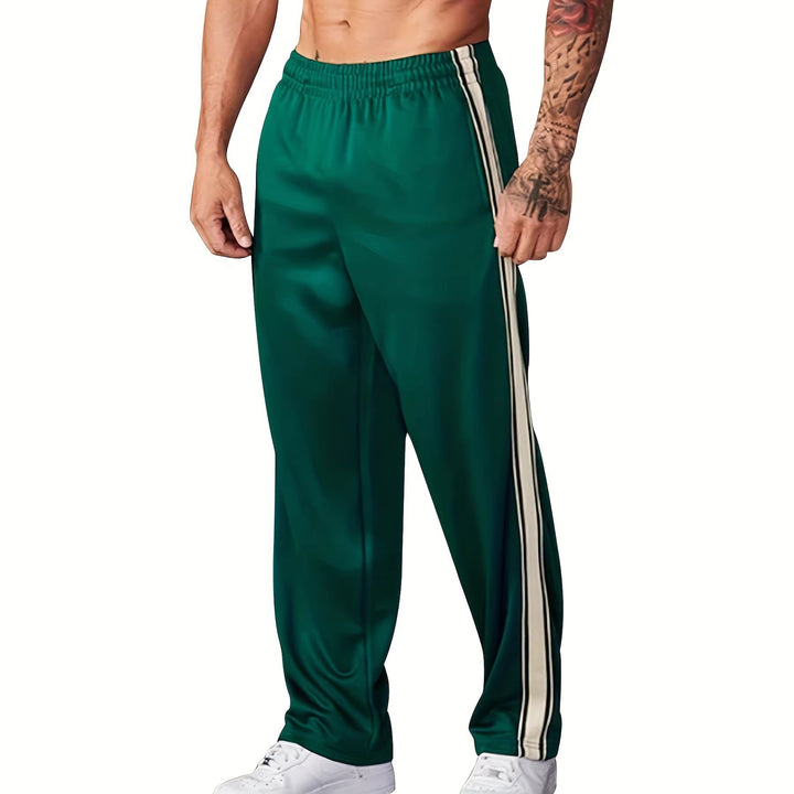 Men's sporty training pants with side tape stripes and elastic waistband Mune Fashion