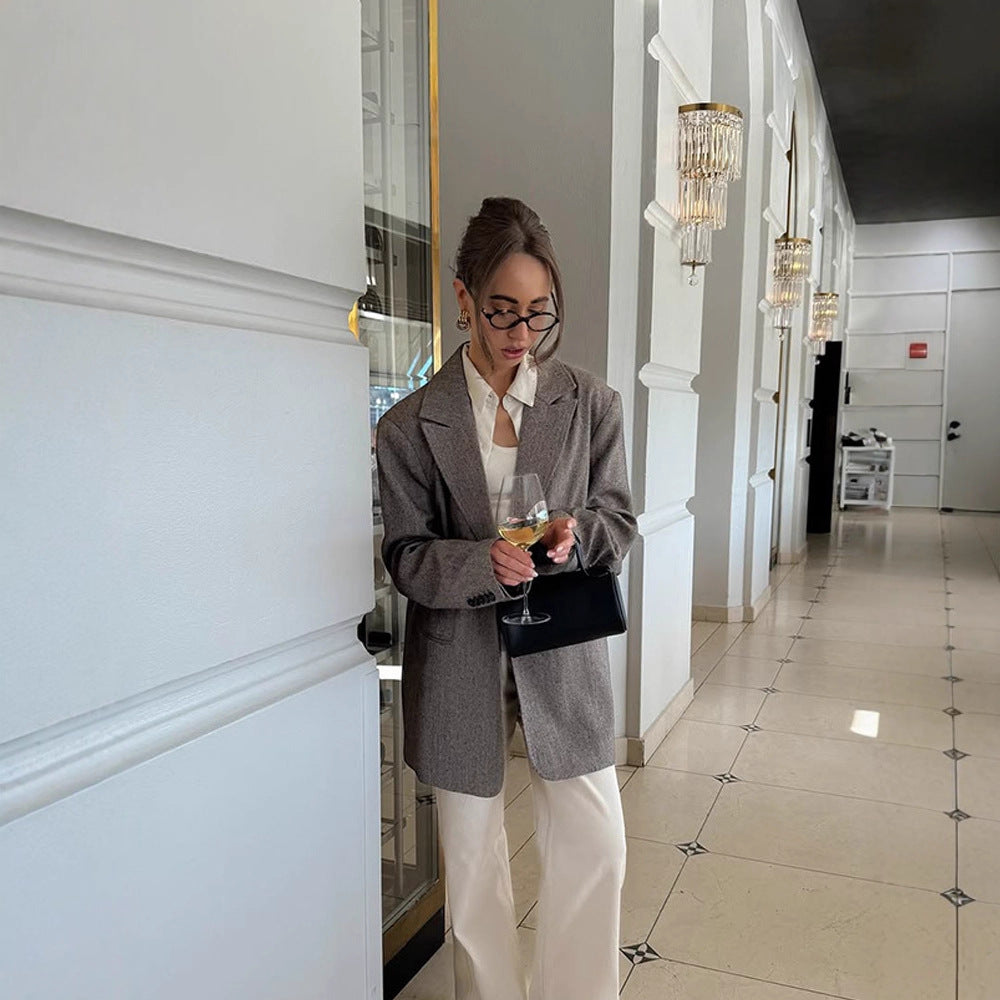 Women's long oversized wool blend coat with single-breasted button placket, notched lapels, and side pockets Mune Fashion