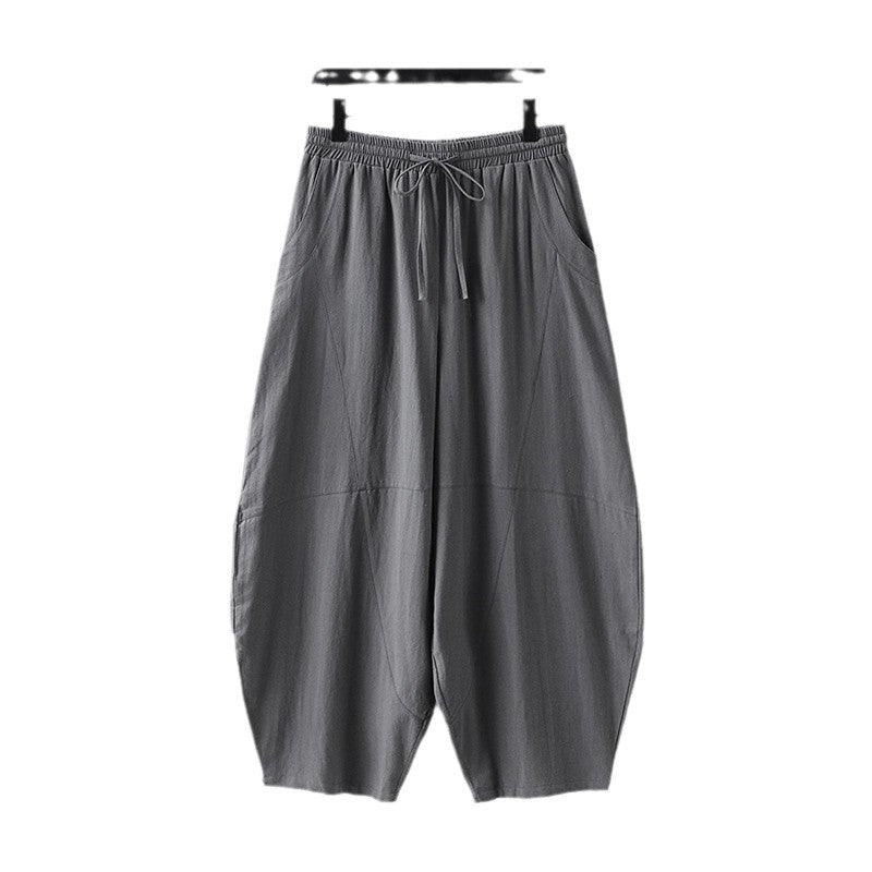 Women's wide harem pants made of lightweight satin with drawstring and side pockets Mune Fashion