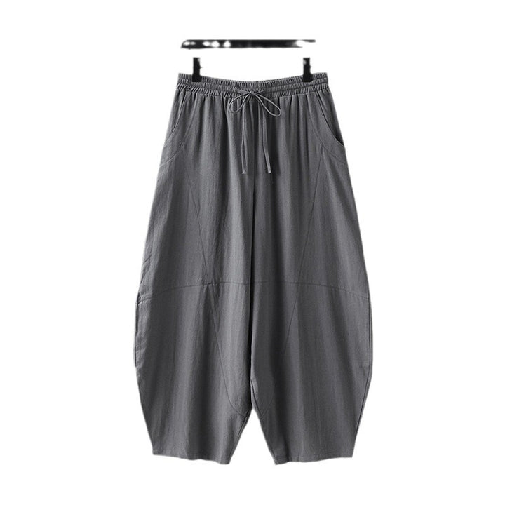 Women's wide harem pants made of lightweight satin with drawstring and side pockets Mune Fashion