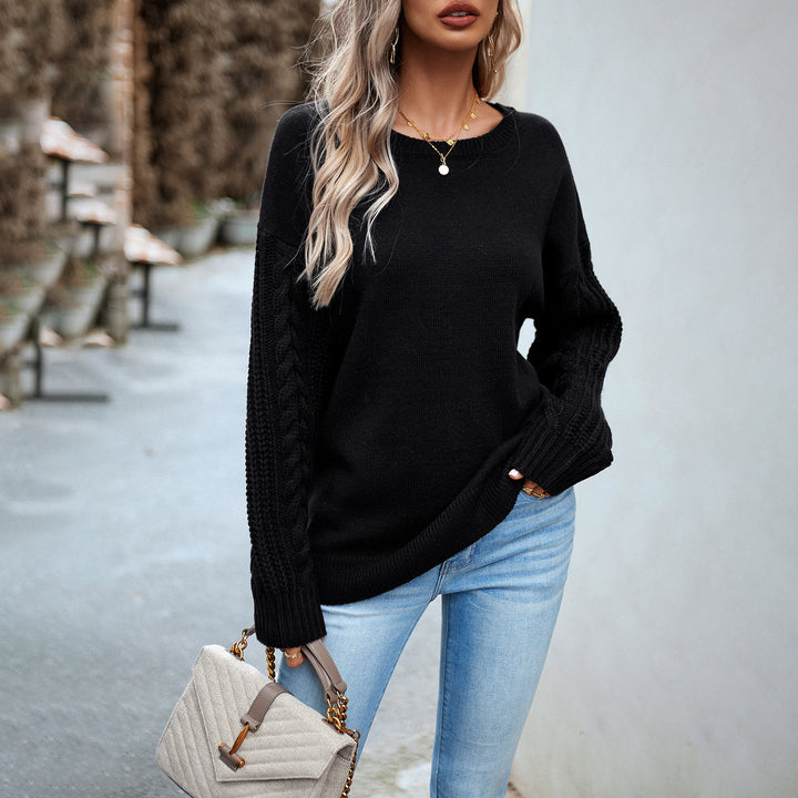 Women's oversized fine knit pullover with round neck and cable pattern sleeves Mune Fashion