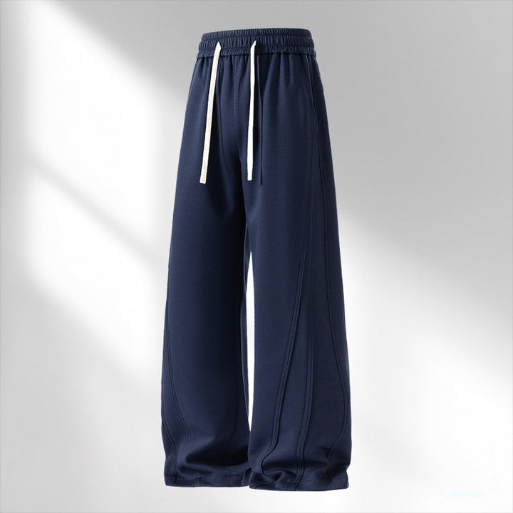 Women's wide lounge sweatpants with elastic drawstring waistband and decorative side seam details Mune Fashion