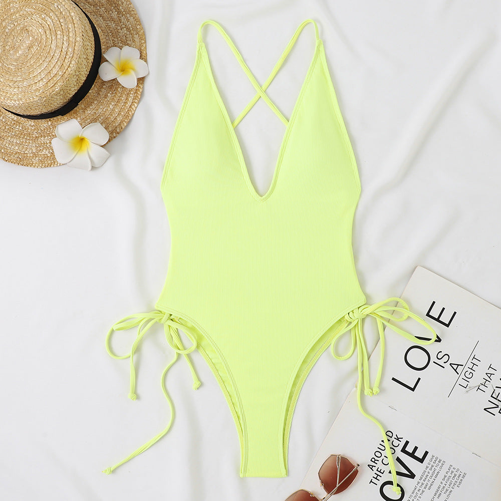 Ladies one-piece swimsuit with deep V-neck and adjustable side ties Mune Fashion