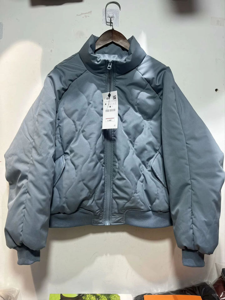 Women's quilted bomber jacket with high stand-up collar, lightweight thermal padding, and ribbed cuffs Mune Fashion