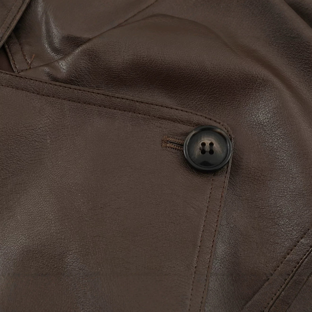 Women's tailored cropped faux leather jacket with tie belt and asymmetric button placket Mune Fashion